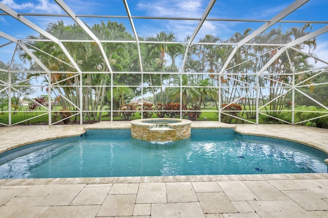 view of swimming pool with a patio area, a lanai, and an in ground hot tub