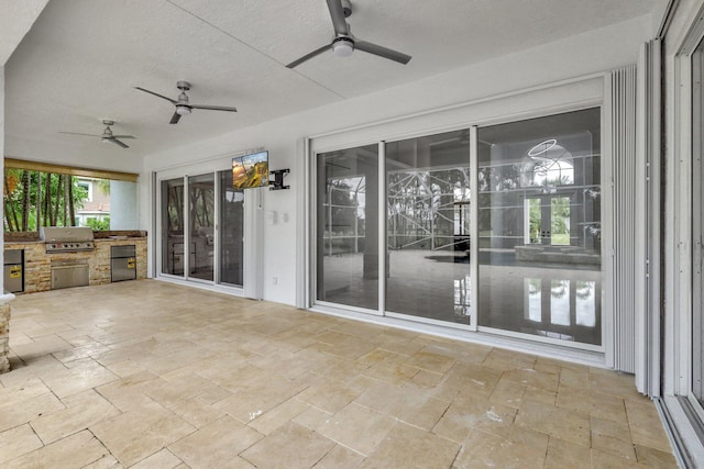 view of patio featuring a grill and exterior kitchen