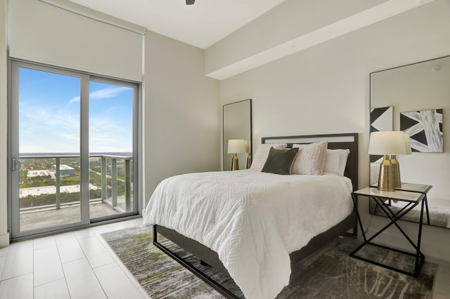 bedroom featuring ceiling fan, access to outside, tile patterned flooring, and multiple windows