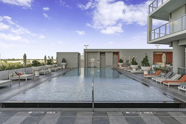 2000 Metropica Way Unit 2607, Sunrise, FL 33323 - community pool featuring an outdoor hangout area and a patio area