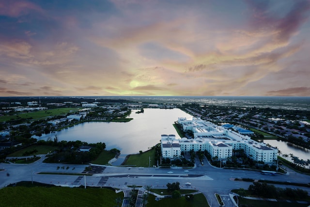 aerial view at dusk with a water view