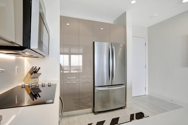 2000 Metropica Way Unit 2607, Sunrise, FL 33323 - kitchen with modern cabinets, gray cabinetry, freestanding refrigerator, recessed lighting, and light tile patterned flooring