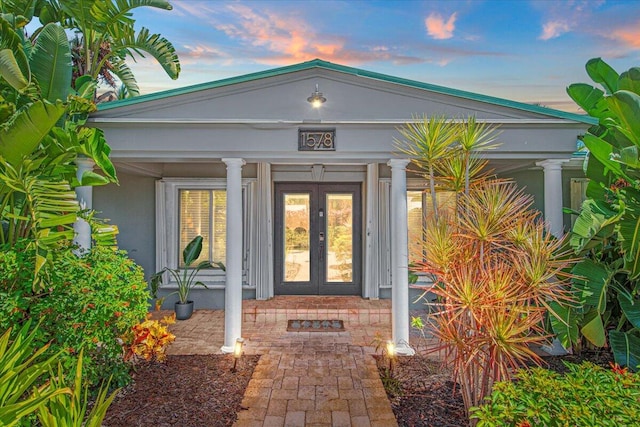 exterior entry at dusk with french doors