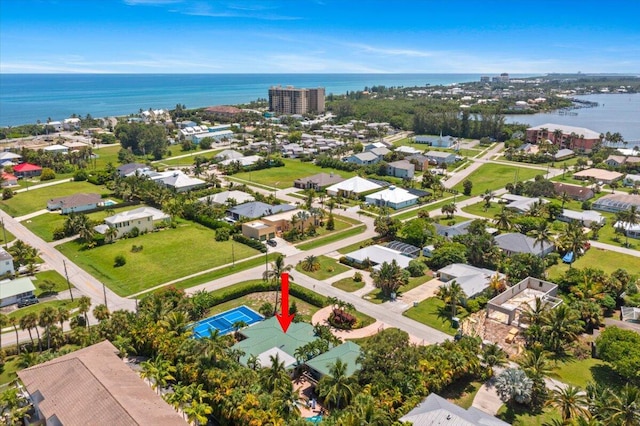 birds eye view of property with a water view