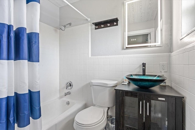 full bathroom featuring shower / bathtub combination with curtain, toilet, tile walls, tasteful backsplash, and vanity