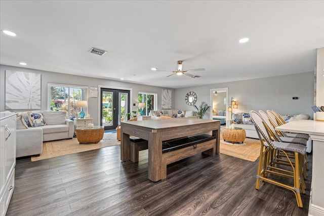 rec room featuring dark wood-type flooring, french doors, and ceiling fan