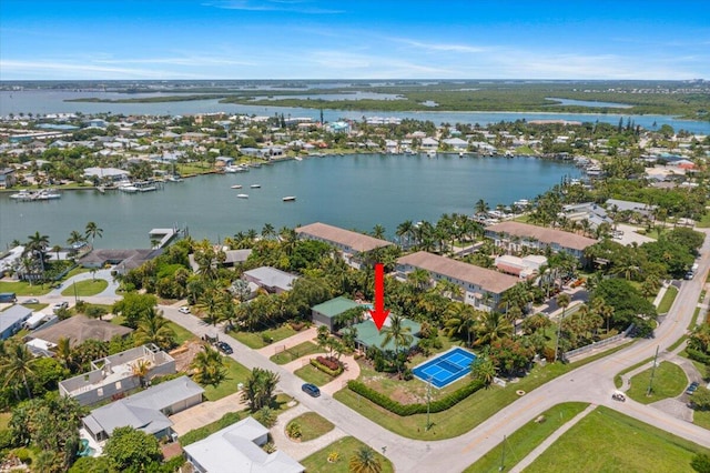 birds eye view of property with a water view