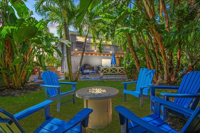 yard at dusk with an outdoor hangout area and a patio area