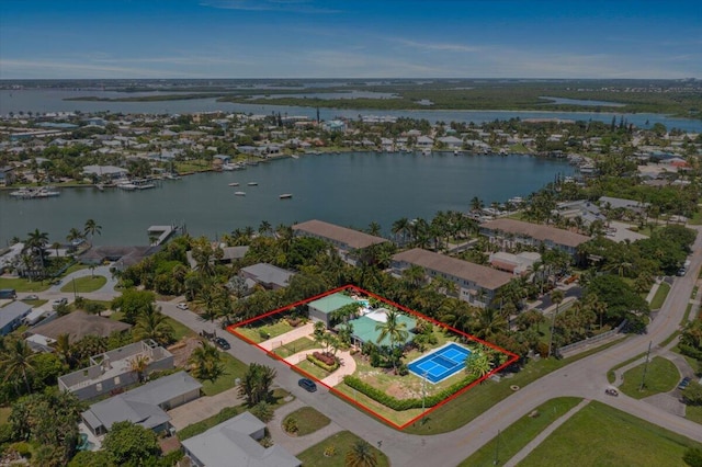 birds eye view of property with a water view