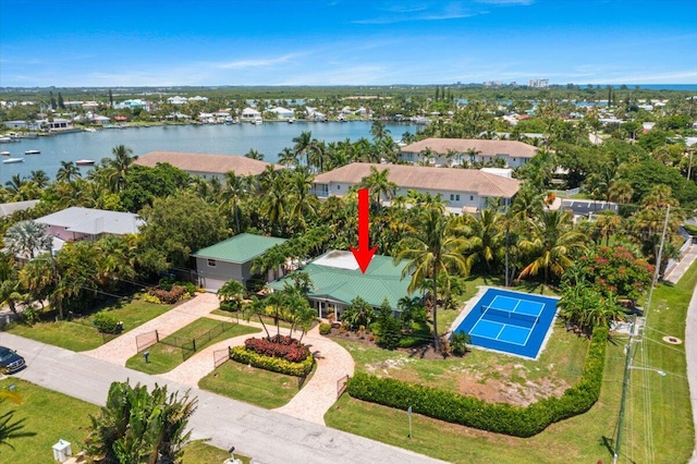 birds eye view of property with a water view