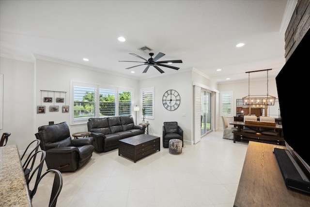 living room with ceiling fan with notable chandelier and ornamental molding