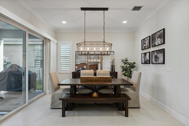 dining room featuring crown molding and an inviting chandelier