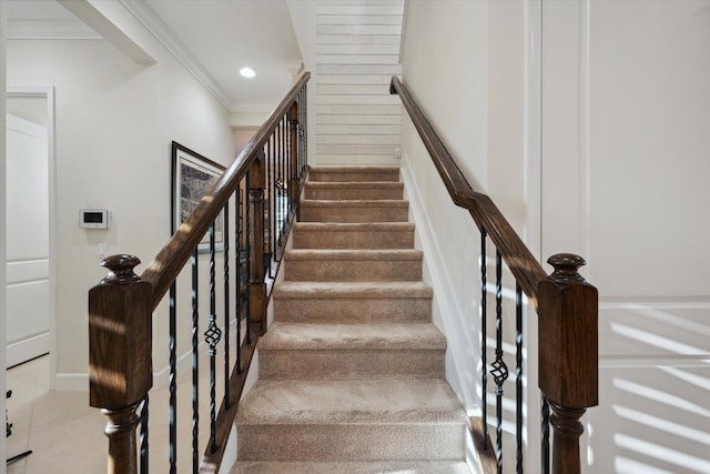 staircase featuring ornamental molding