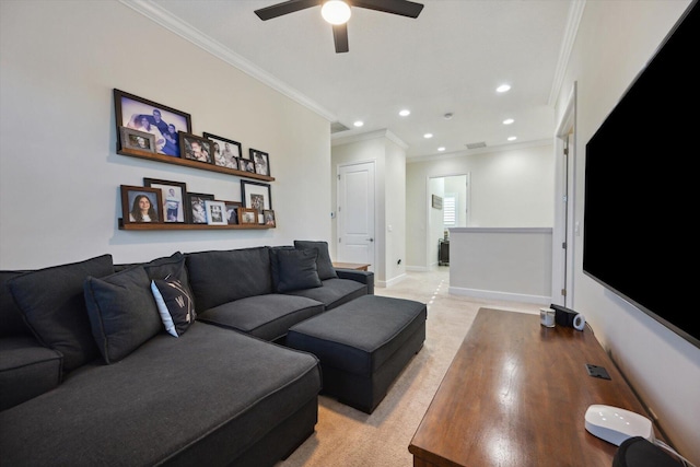 carpeted living room with crown molding and ceiling fan