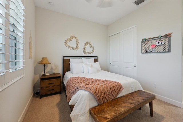 carpeted bedroom with a closet