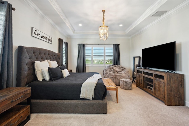 carpeted bedroom with a raised ceiling, ornamental molding, and a chandelier