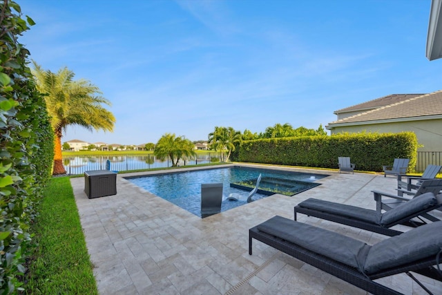 view of pool featuring a patio area, an in ground hot tub, and a water view