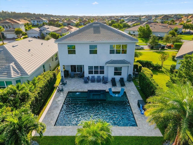 back of property with a patio area