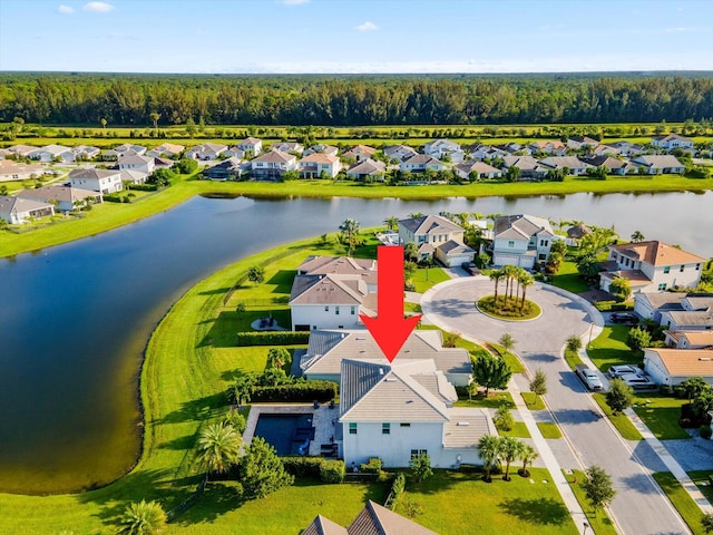 birds eye view of property with a water view