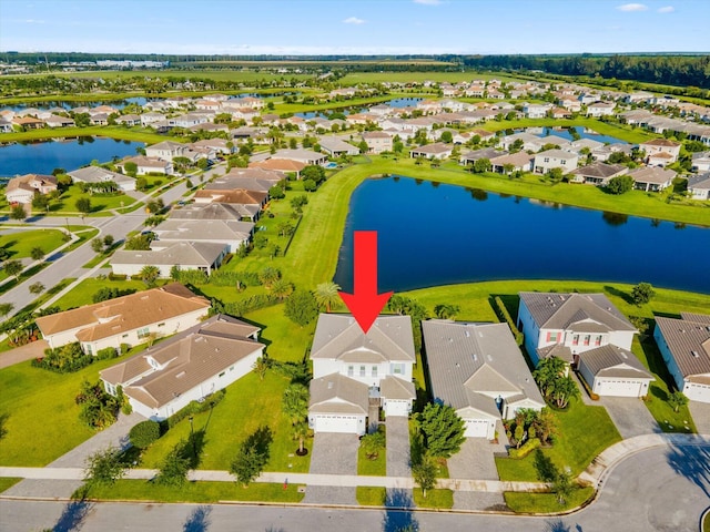 birds eye view of property featuring a water view