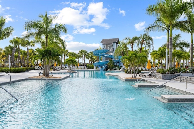 view of pool featuring a patio and a water slide