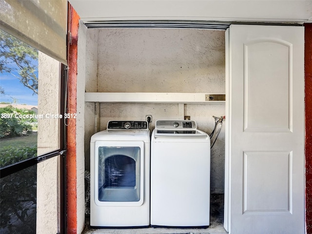 clothes washing area featuring washing machine and dryer