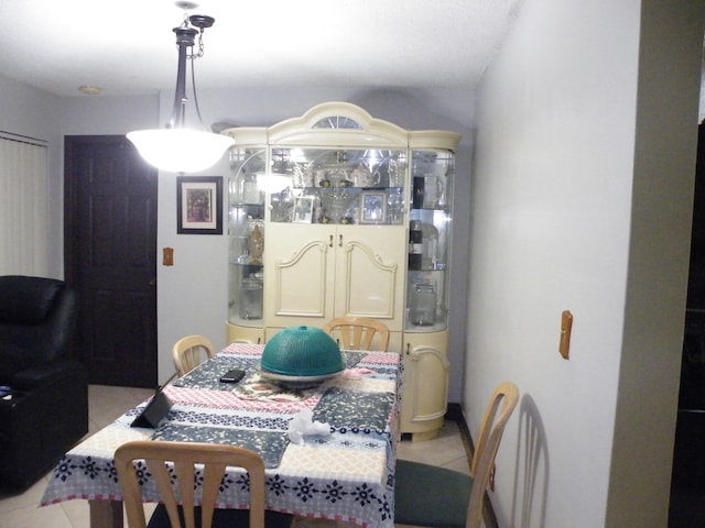 dining area with light tile patterned floors