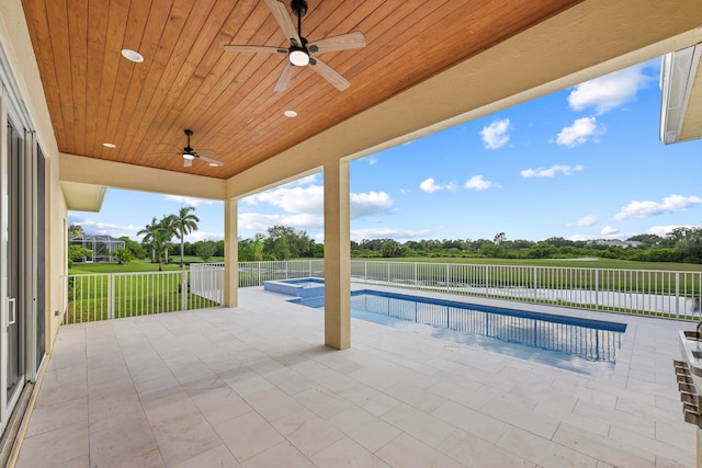 view of swimming pool with ceiling fan and a patio