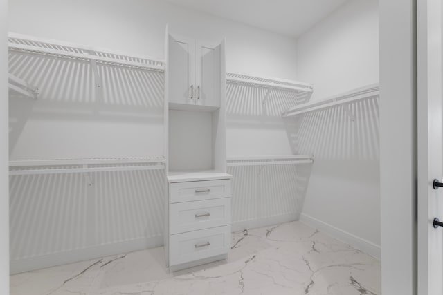 spacious closet featuring light tile patterned flooring