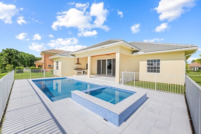 view of swimming pool featuring an in ground hot tub, a yard, and a patio