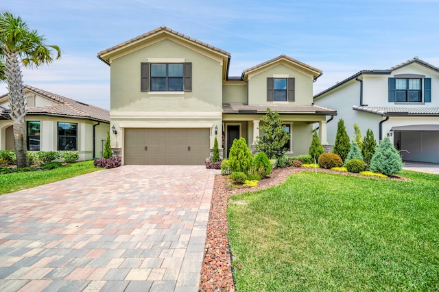 view of front facade featuring a front lawn and a garage