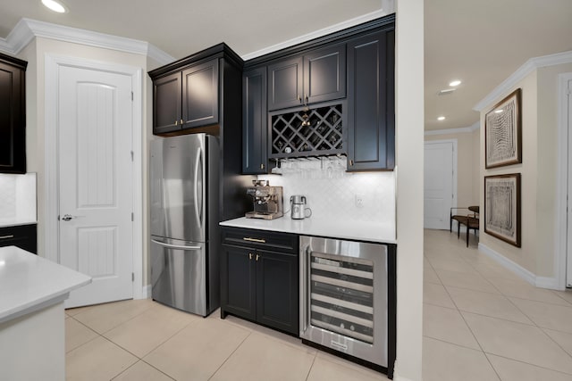 kitchen with ornamental molding, decorative backsplash, light tile patterned floors, beverage cooler, and refrigerator