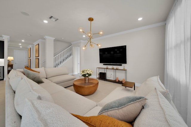 living room with a notable chandelier and ornamental molding