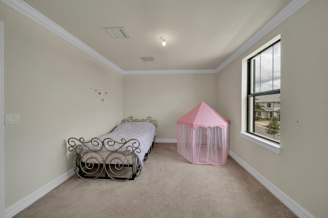 bedroom with ornamental molding, light colored carpet, and multiple windows