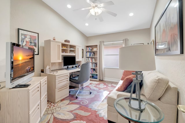 office with light hardwood / wood-style floors, vaulted ceiling, and ceiling fan