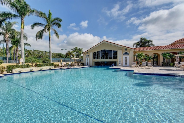 view of swimming pool with a patio