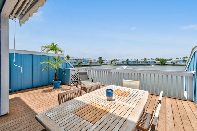 wooden deck featuring a water view