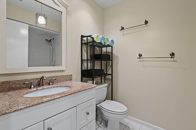 bathroom featuring tile patterned floors, vanity, and toilet