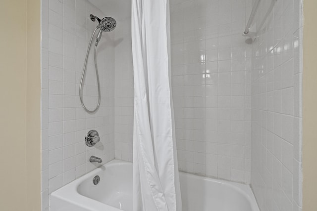 bathroom with shower / tub combo with curtain