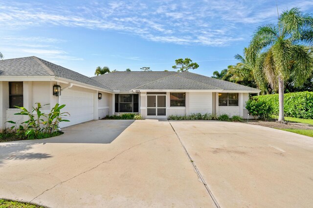 ranch-style home featuring a garage