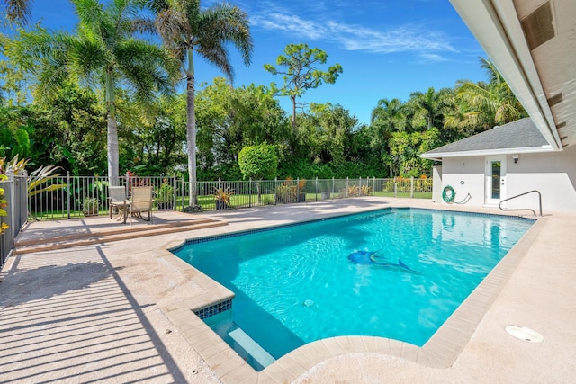 view of pool with a patio, fence, and a fenced in pool