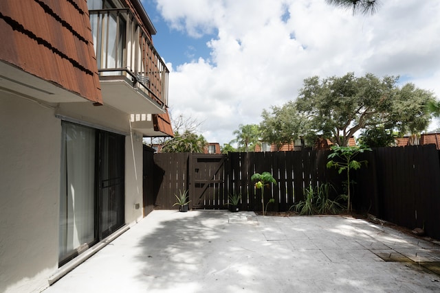 view of patio with a balcony