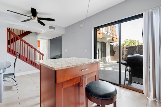 kitchen featuring ceiling fan and light tile patterned floors