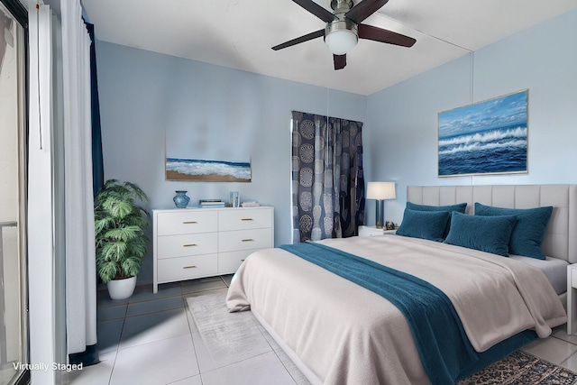 tiled bedroom with ceiling fan