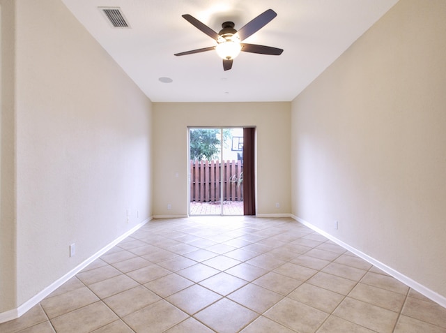 tiled empty room with ceiling fan