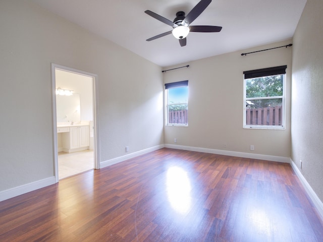 empty room featuring ceiling fan and wood-type flooring