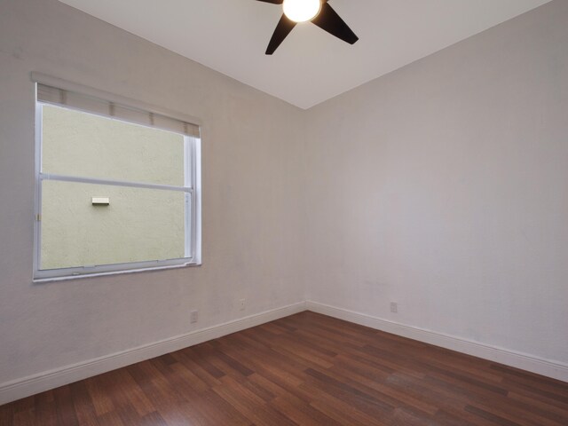 empty room featuring ceiling fan, hardwood / wood-style floors, and a healthy amount of sunlight