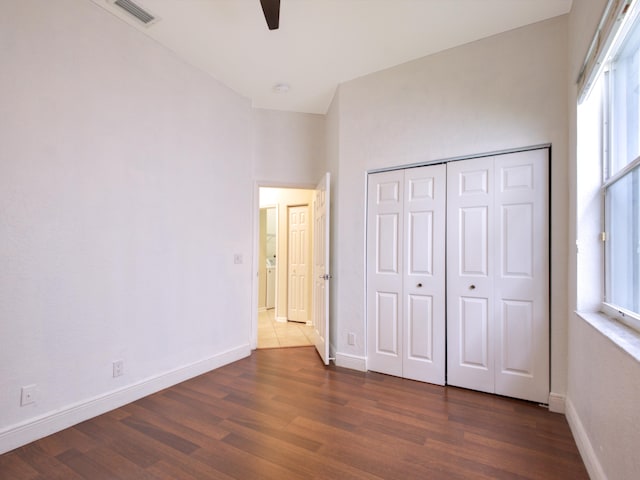 unfurnished bedroom with ceiling fan, a closet, and tile patterned floors