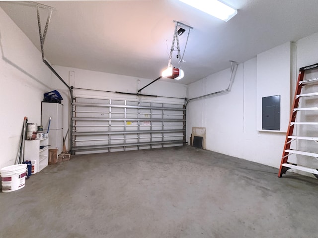 garage featuring a garage door opener and electric panel