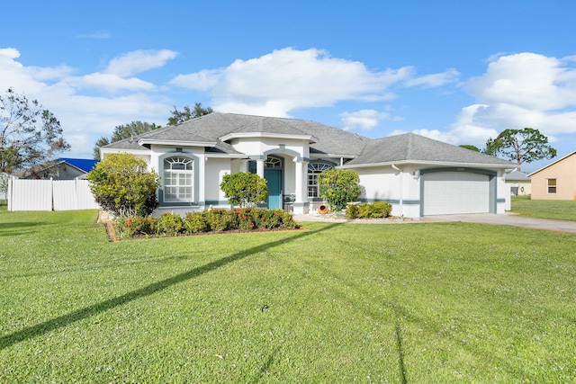 view of front facade featuring a garage and a front lawn